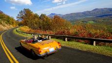 A convertible drives along the Blue Ridge Parkway in Virginia, USA.